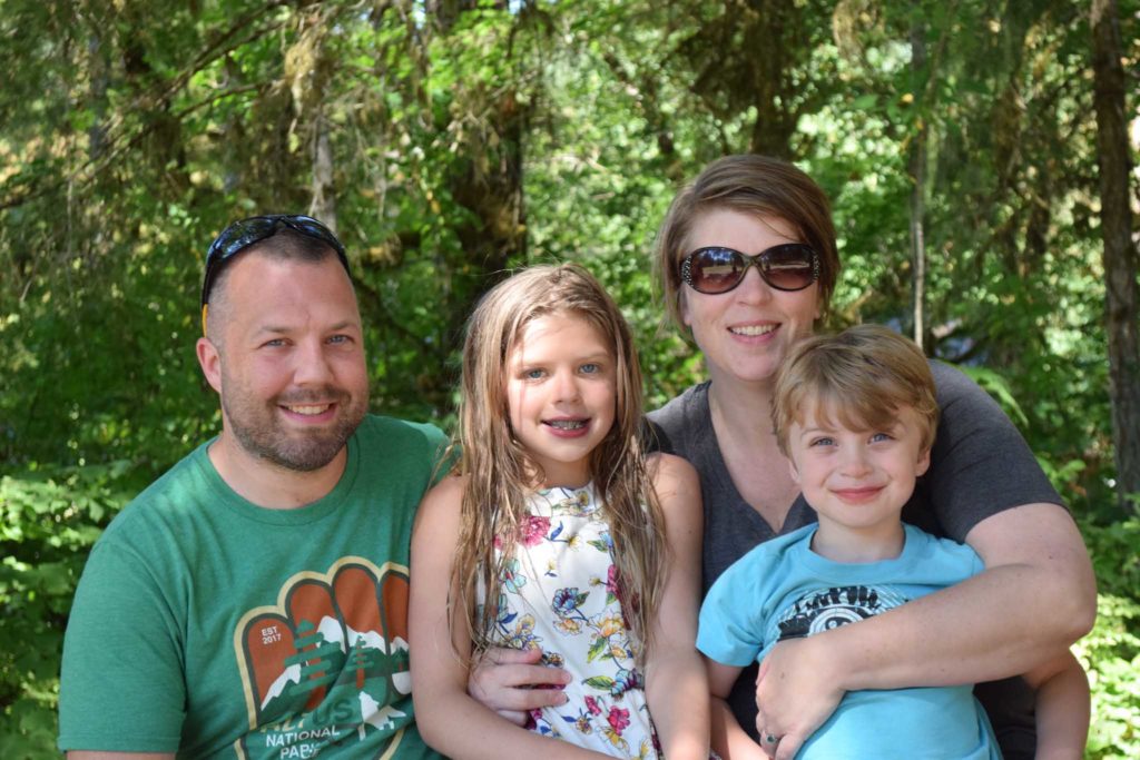 Family of a father, mother, daughter, and son at family camp at Camp Lutherwood Oregon