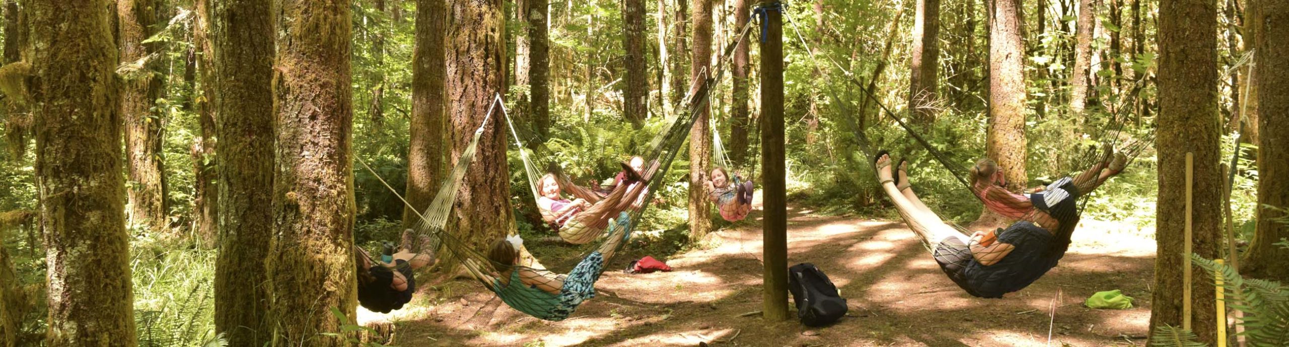 Campers relaxing on hammocks in hammock village at Camp Lutherwood Oregon