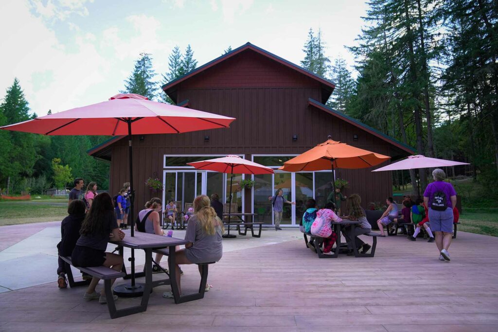 Campers and staff gathered on the patio outside the Dining Hall