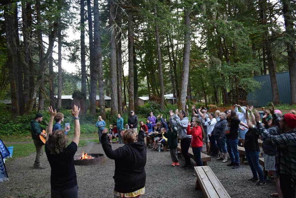 Campers and staff singing at Lower Campfire
