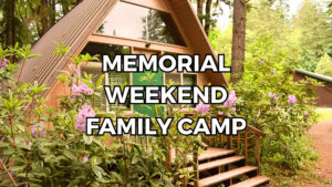 A-frame Cabin with the text "Memorial Weekend Family Camp"
